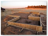 Buildiong up the forms for the L&D observatory slab.  The south side forms are about 18 inches taller than the north side forms due to the site slope.